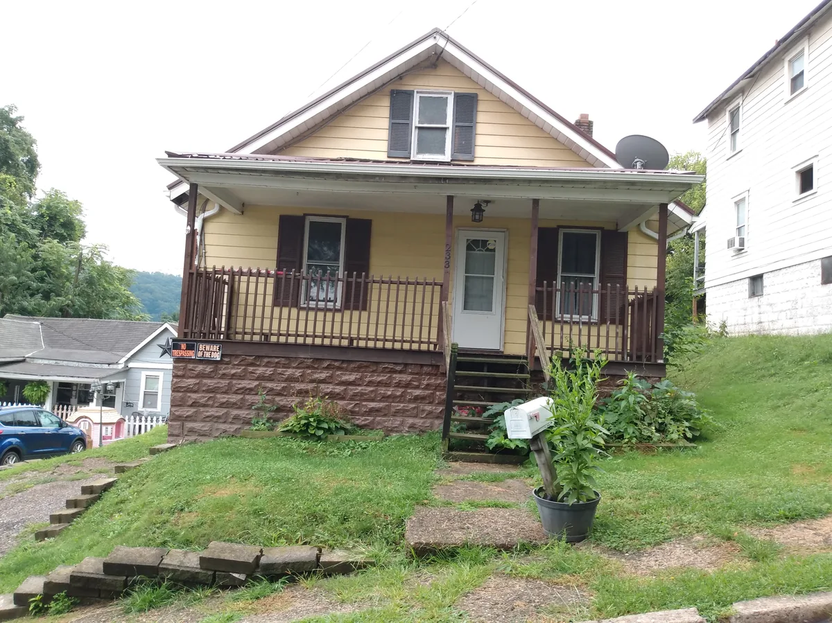 Covered front porch with siding and foundation veneer